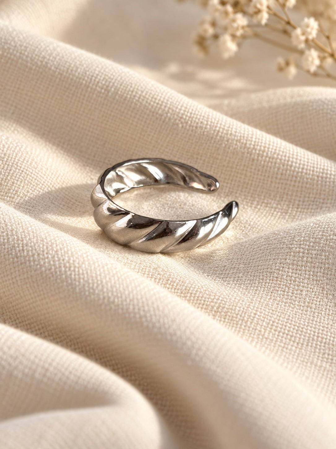 Niska silver-tone twisted band replica ring editorial view 5