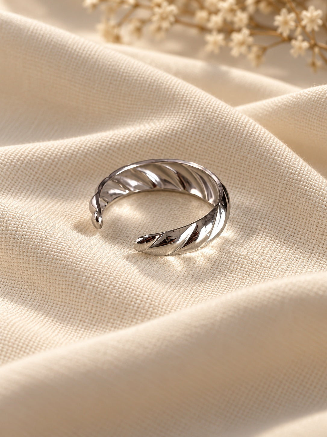 Niska silver-tone twisted band replica ring editorial view 6