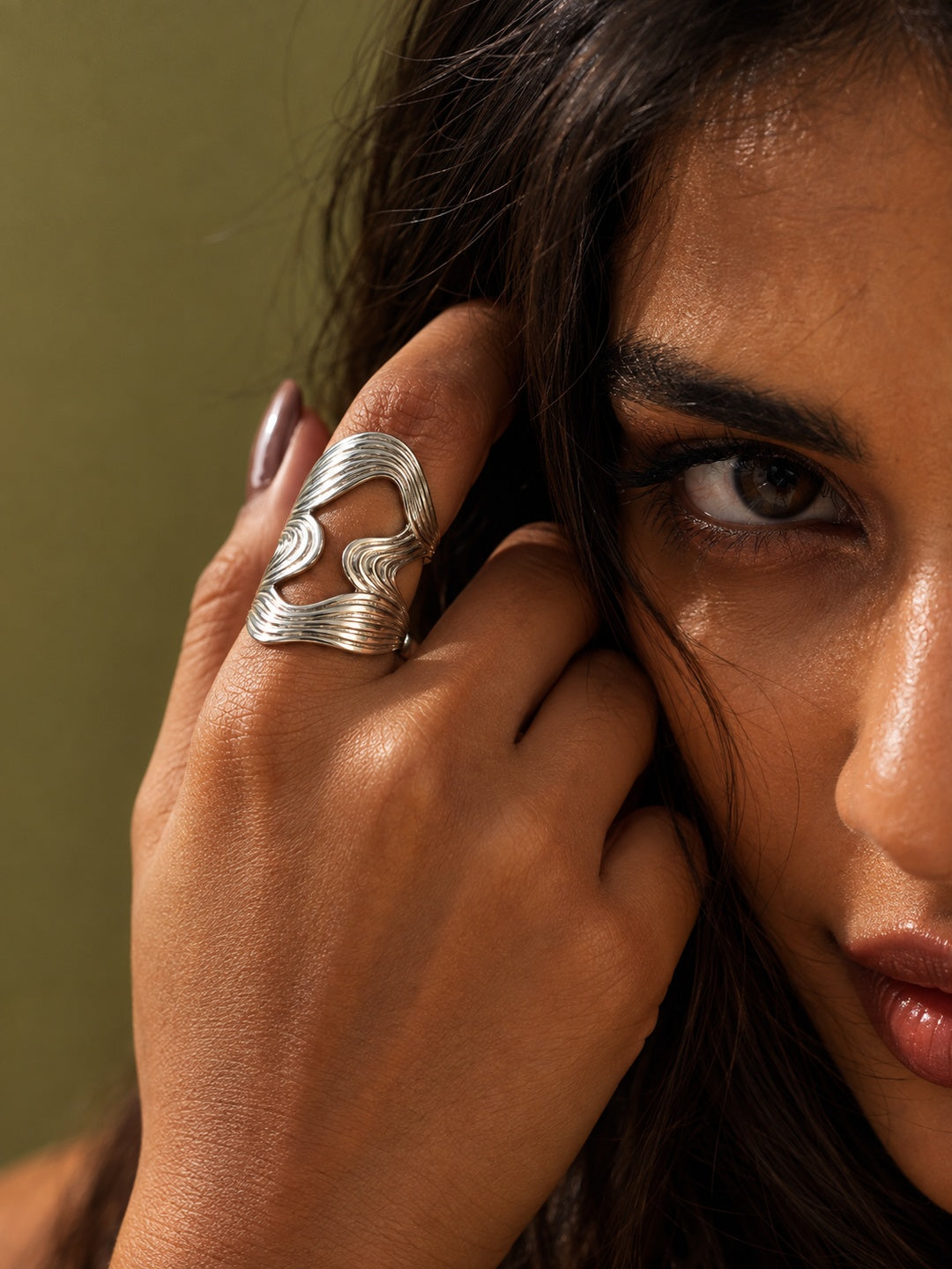 Niska statement ring worn in close-up editorial fashion portrait
