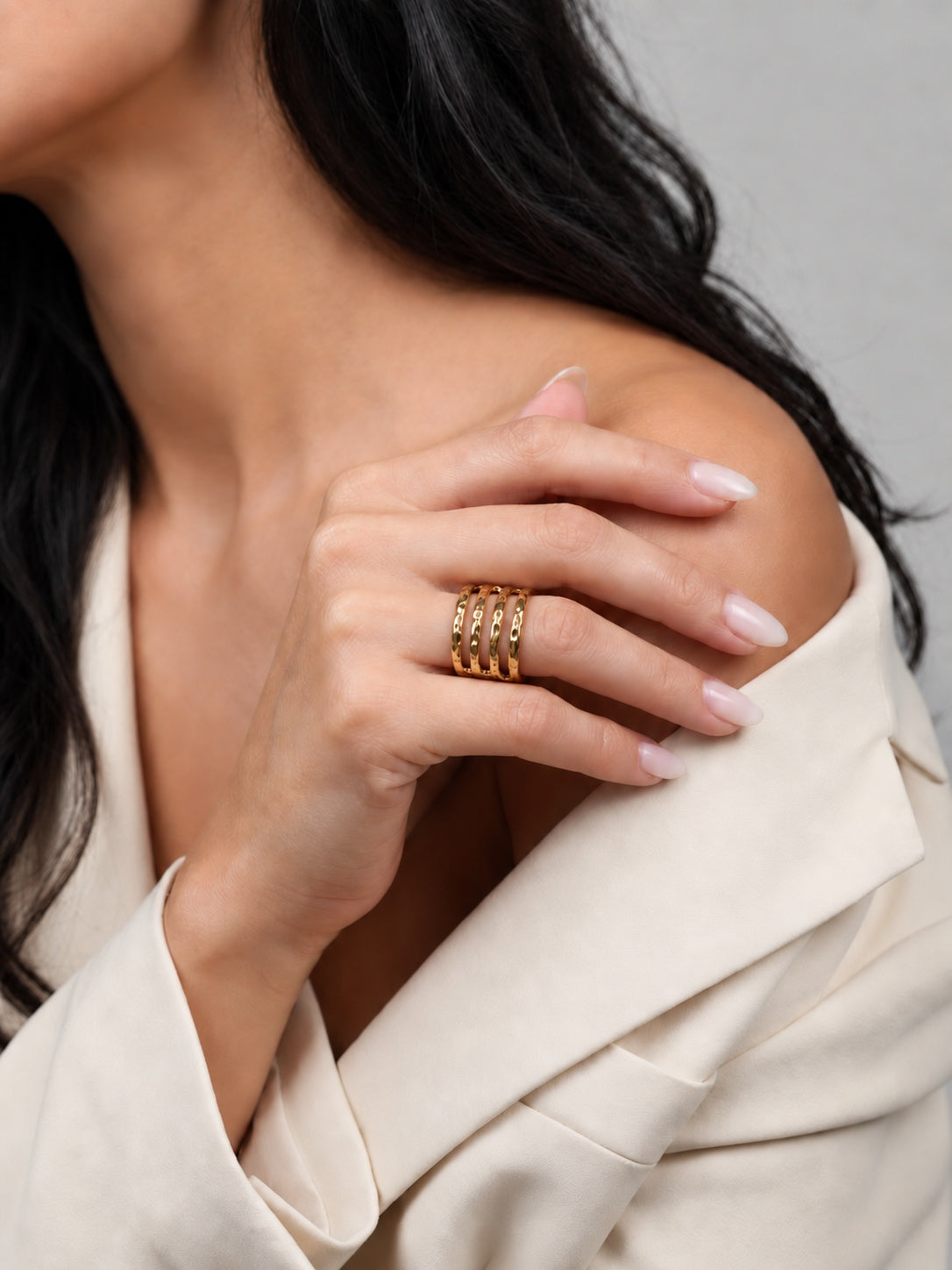 Niska Sculpted Waves gold-tone band ring worn on model