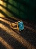 Niska blue-green cabochon statement ring with gold-tone split band