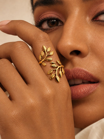 Niska gold-tone botanical leaf replica ring on model