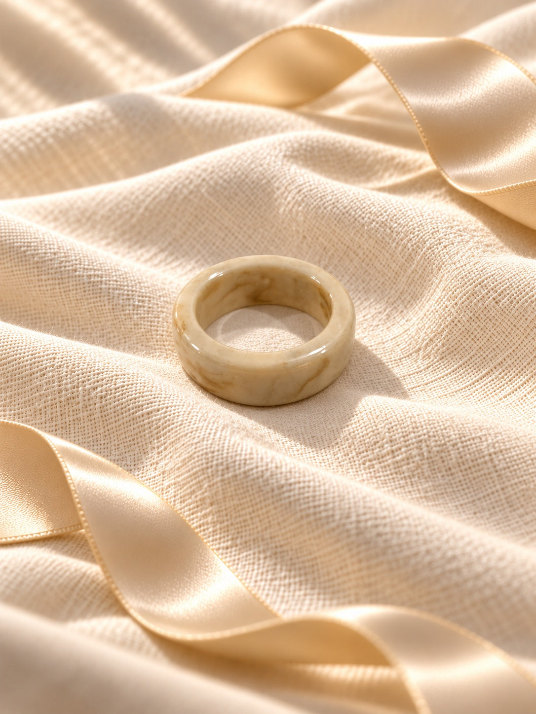 Niska marbled cream statement ring replica on ivory linen