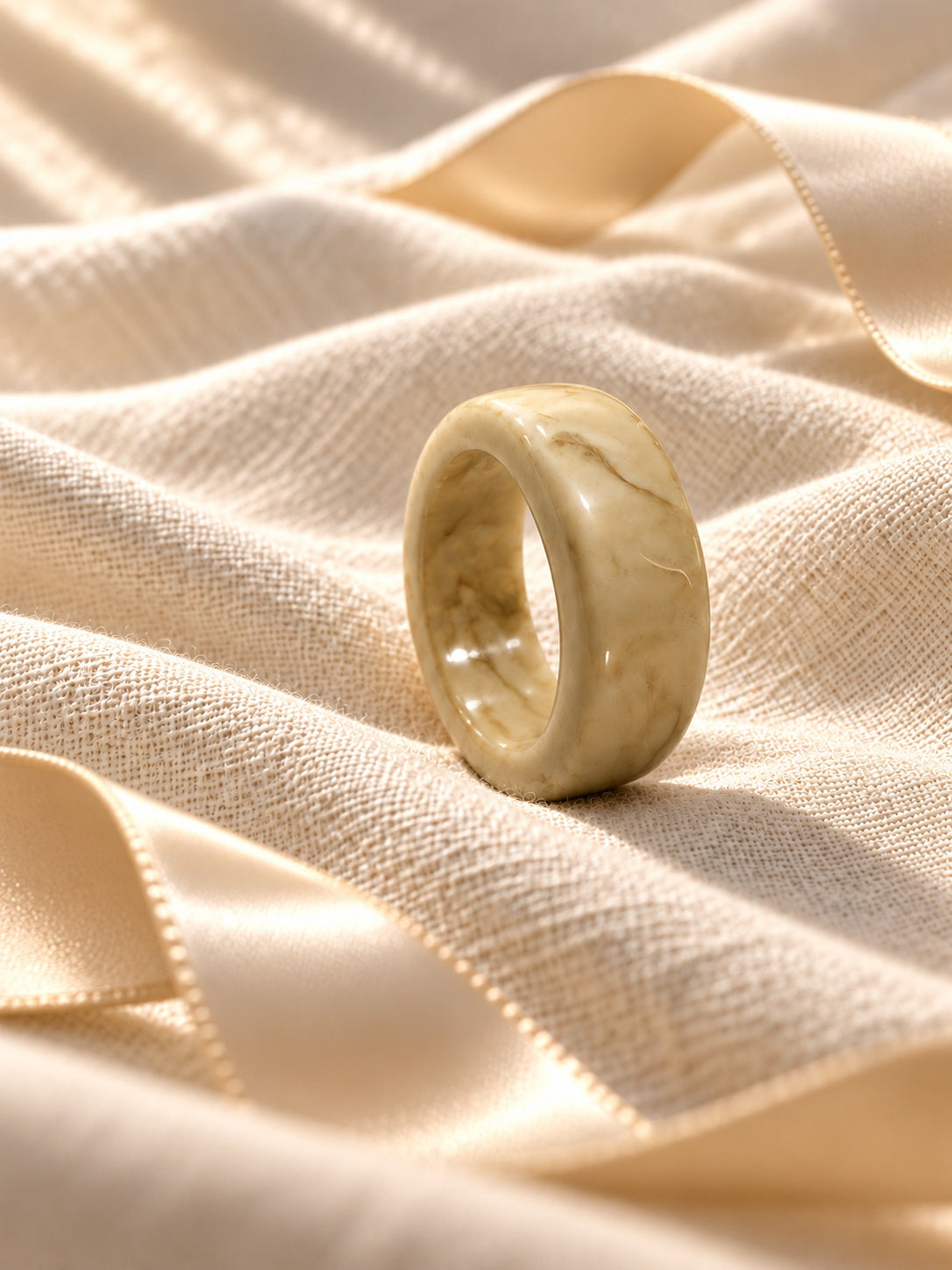 Niska marbled cream statement ring replica on ivory linen