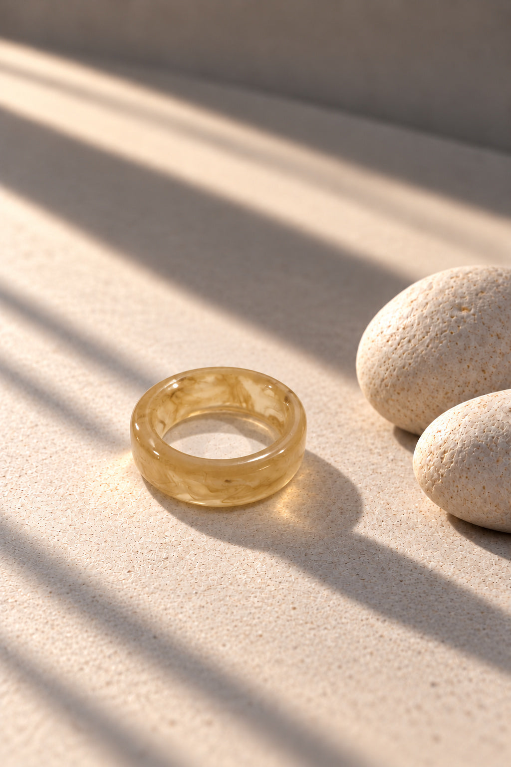 Champagne marble ring worn on model hand