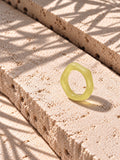 Lemon Glow Sculptural Replica Ring on travertine stone, view 7