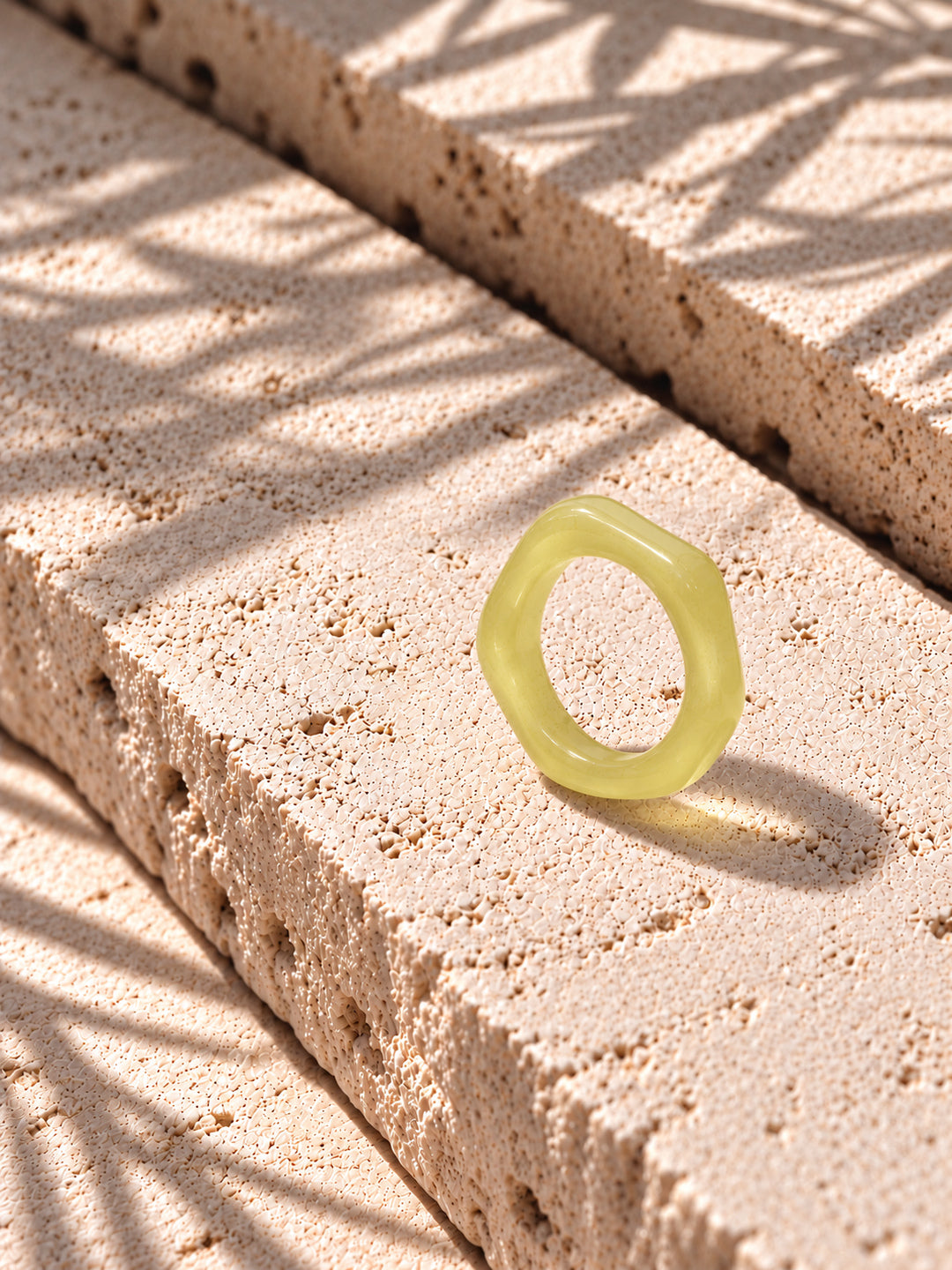 Lemon Glow Sculptural Replica Ring on travertine stone, view 7
