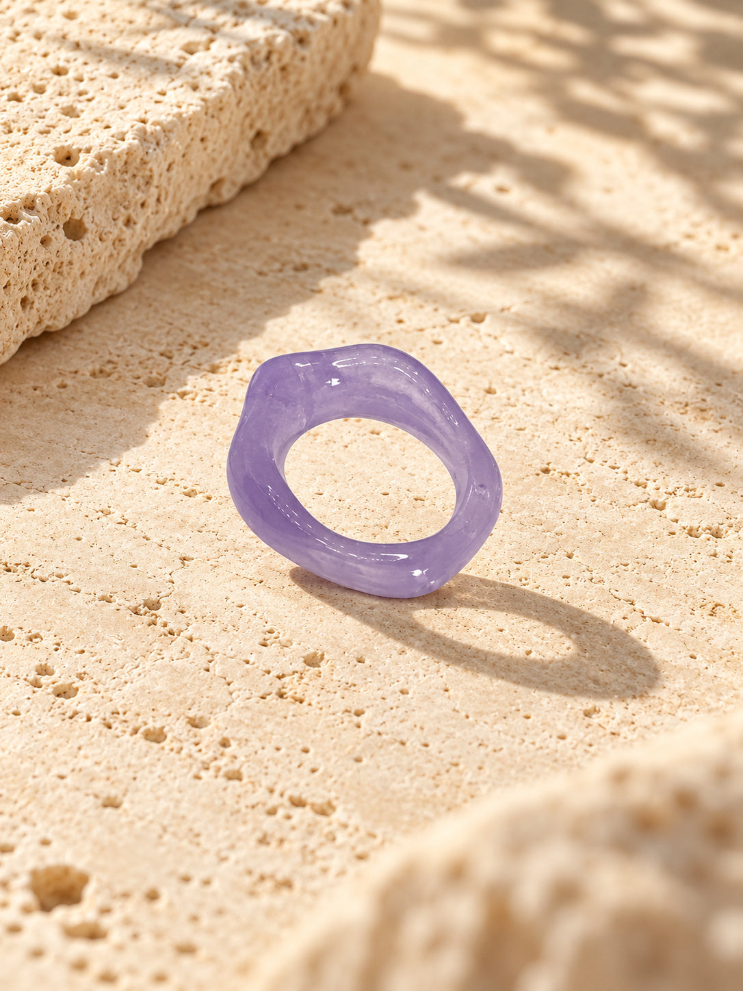 Niska lavender sculpted replica statement ring worn on a model's hand