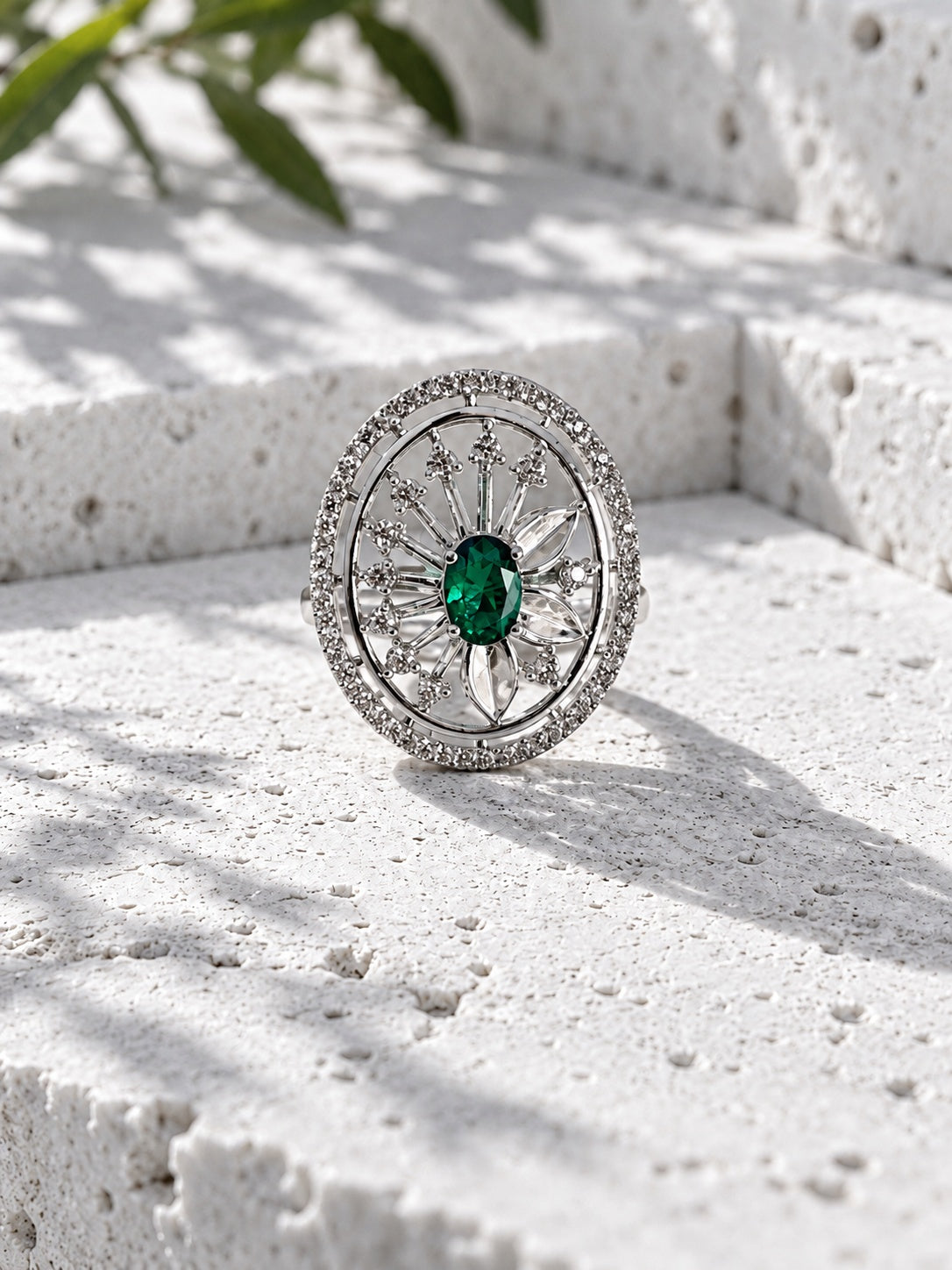 Niska green oval floral AD Stone statement ring worn on hand close-up