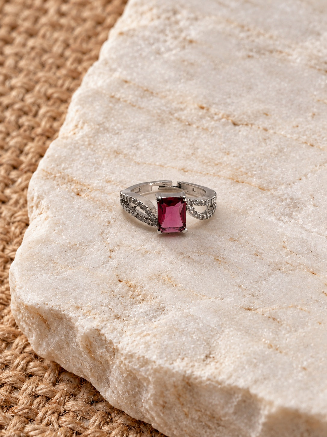 Niska raspberry pink rectangular AD Stone ring worn on model
