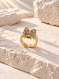 Gold insect ring reverse angle with white stones