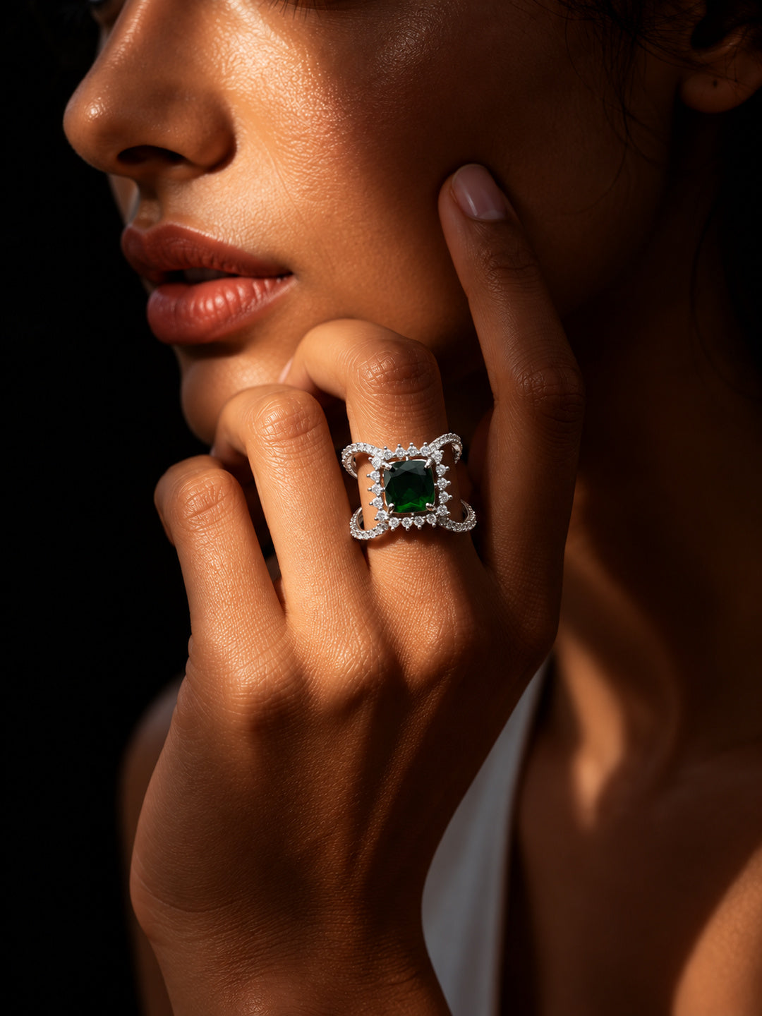 Niska green AD stone statement ring worn on model's middle finger