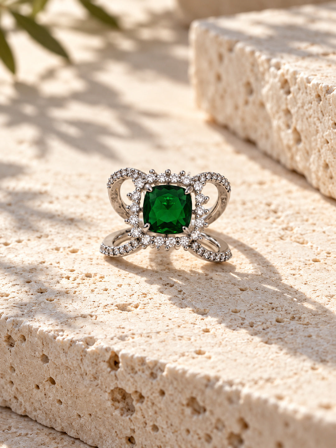 Niska green AD stone statement ring in silver-tone setting, ornate loop detail