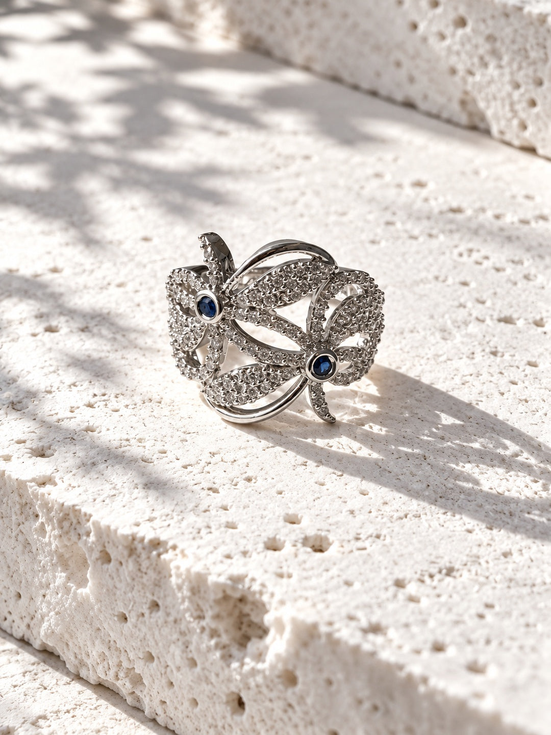 Blue Blossom AD stone ring worn on model hand