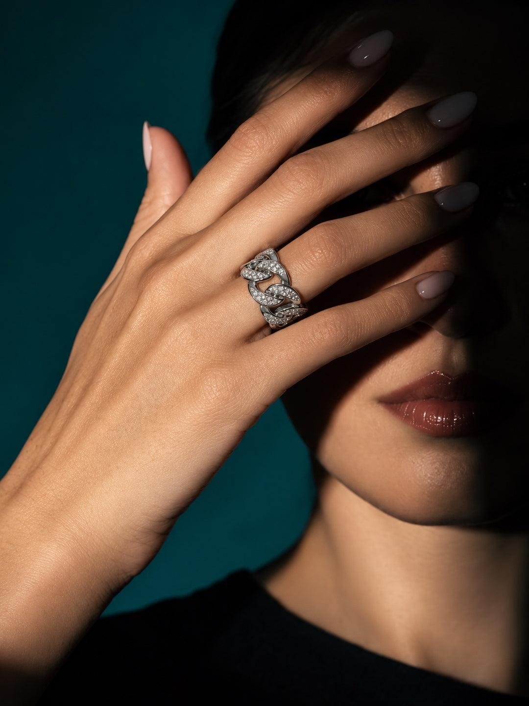 Niska silver-tone chain link replica ring worn on model hand