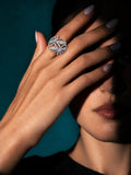 Niska light lavender floral AD stone ring worn on index finger