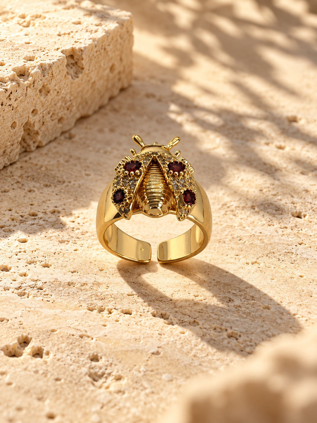Replica gold-tone ladybug ring with burgundy stones - product angle 2
