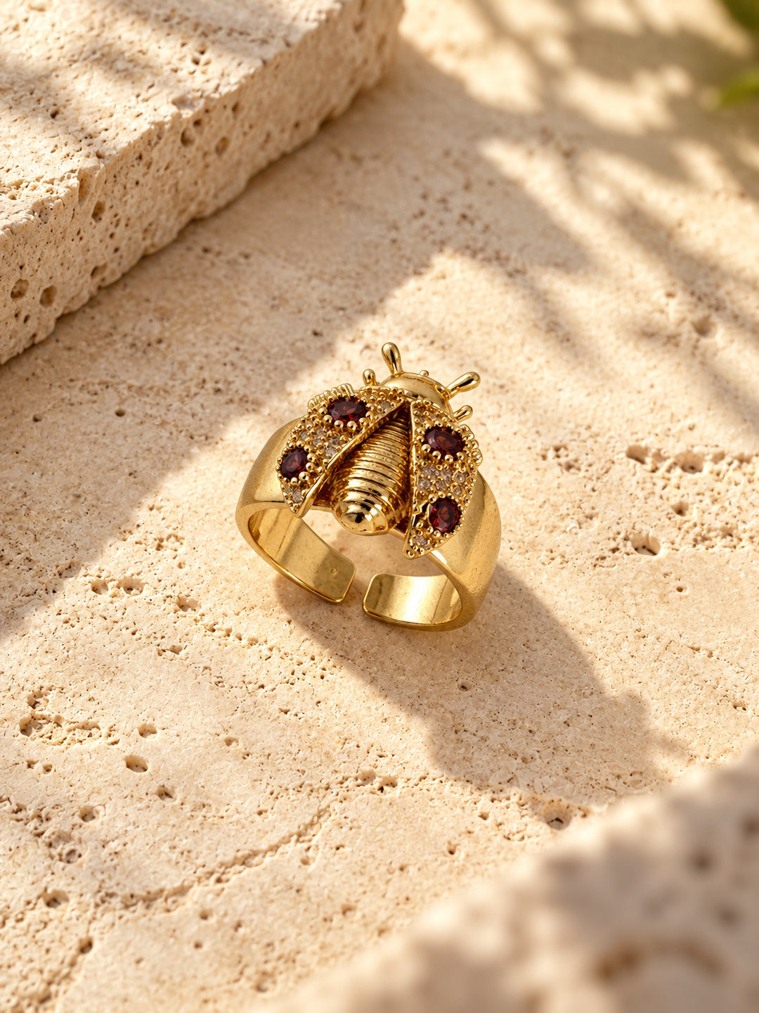Replica gold-tone ladybug ring with burgundy stones - product angle 3