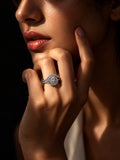 Niska silver-tone swirl AD Stone ring worn on a model's hand
