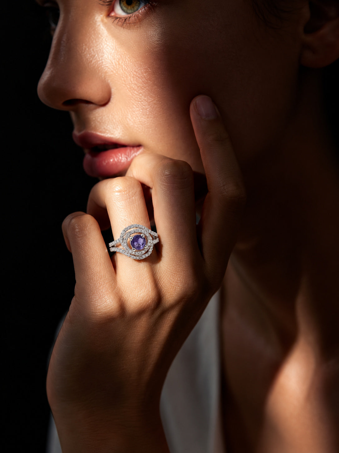 Niska violet halo AD stone statement ring worn on hand
