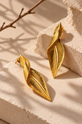 Gold leaf earrings in a sculptural stone setup