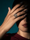 Niska green floral AD stone ring worn on a model's hand
