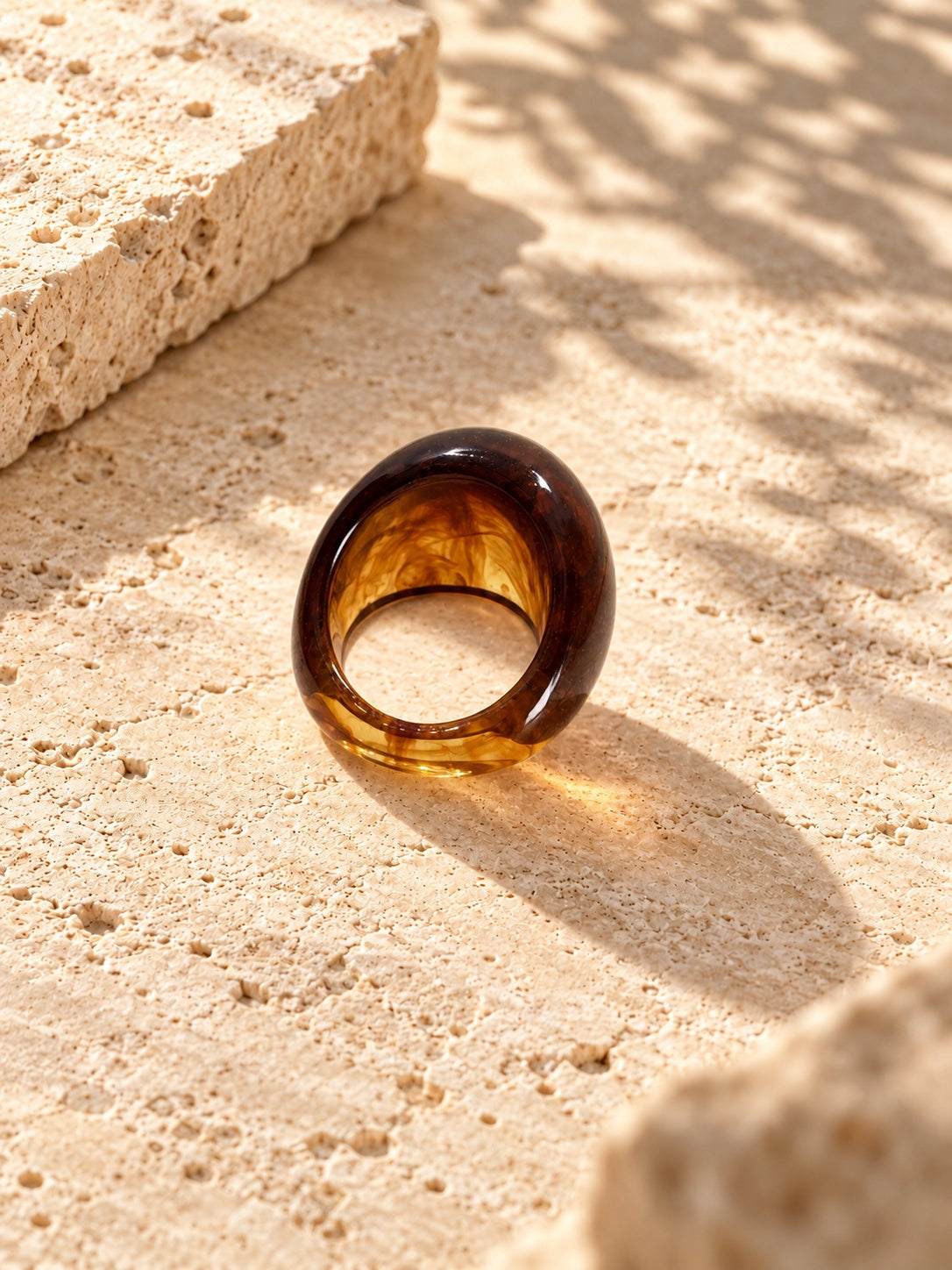 Niska amber swirl chunky replica ring on ivory travertine, view 2