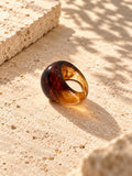 Niska amber swirl chunky replica ring on ivory travertine, view 3