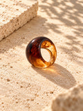 Niska amber swirl chunky replica ring on ivory travertine, view 4