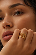 Niska gold-tone beaded multi-band ring worn on model