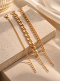 Niska gold-tone chain bracelet replica trio on cream stone