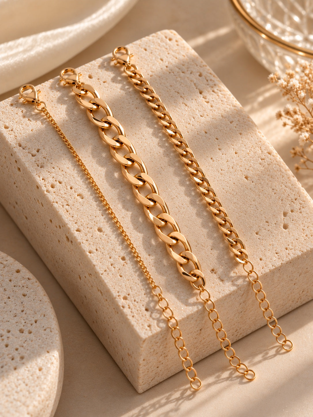 Model wearing Niska gold-tone chain bracelet replica trio