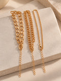Niska gold-tone chain bracelet replica trio on cream stone