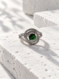 Niska green oval AD stone swirl ring in silver tone