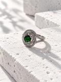 Niska green oval AD stone swirl ring in silver tone