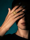 Niska Molten Gold Replica Statement Ring worn on model's middle finger
